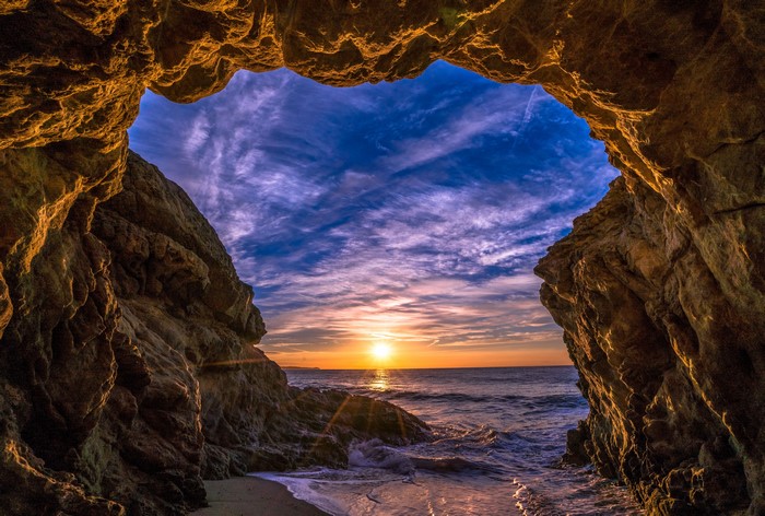 Sunset viewed from a cave entrance in Malibu, USA