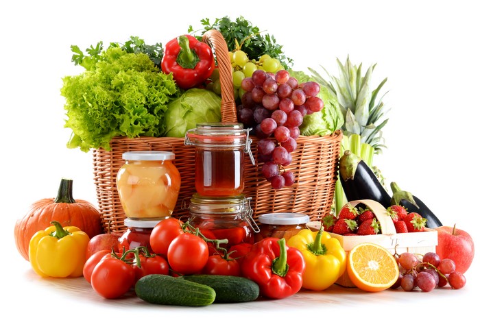 Assortment of fresh fruits and vegetables in a wicker basket