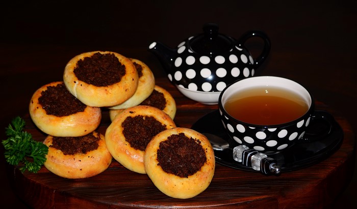 Pastries with tea and a polka dot teapot