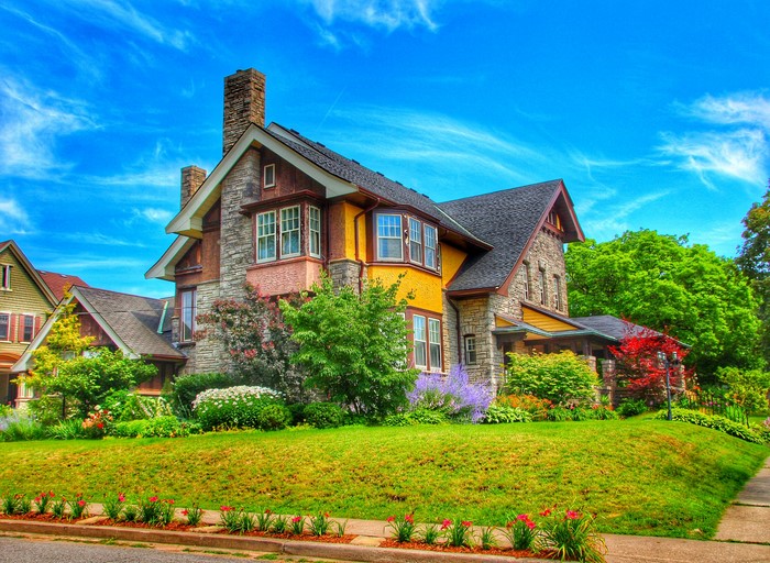 Yellow and stone house with garden in St. Catharines, Ontario