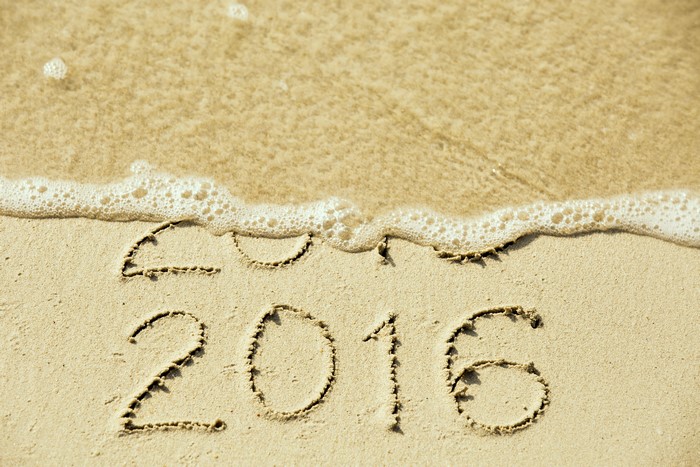 2016 written in sand with waves