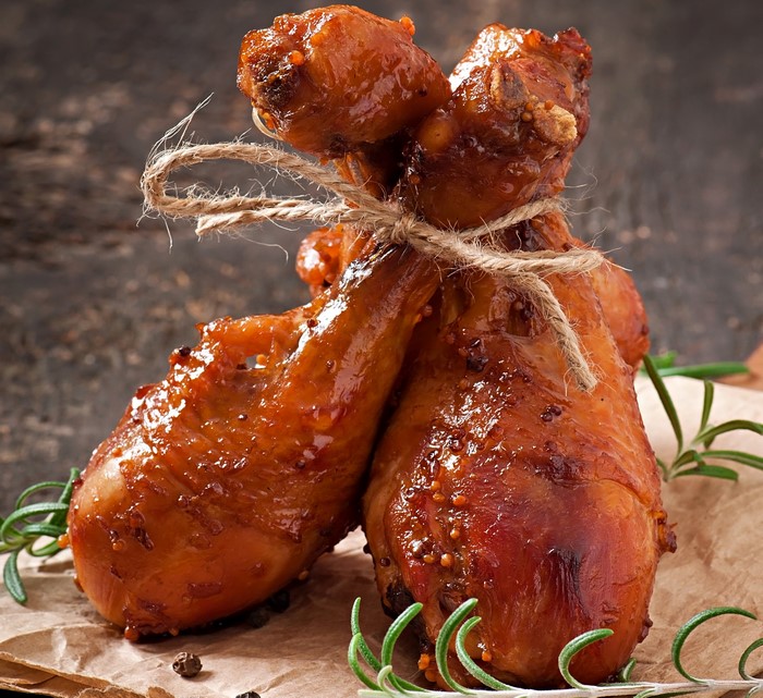 Roasted chicken drumsticks tied with twine