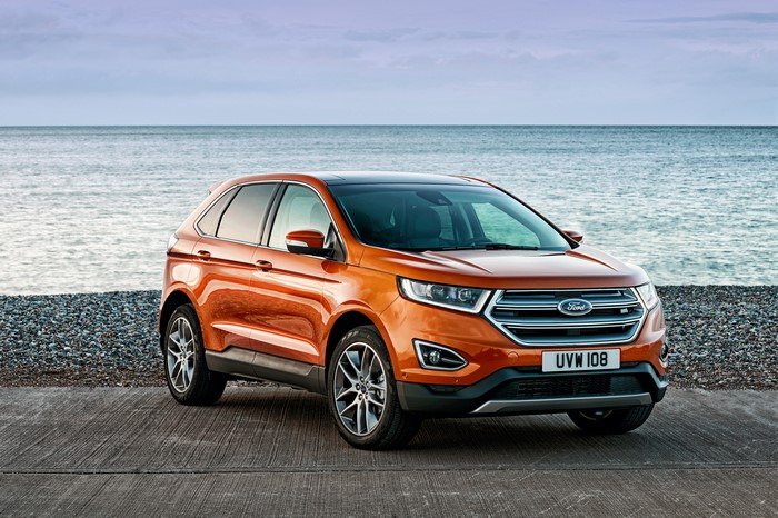 Orange 2015 Ford Edge by the Sea