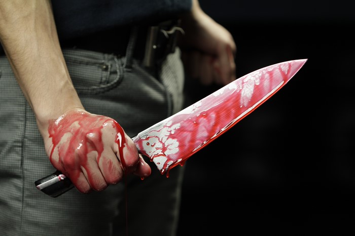 Bloody Knife Held in Hand