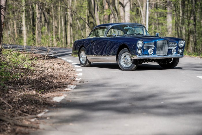 Blue 1959-61 Facel Vega HK500 driving on a road