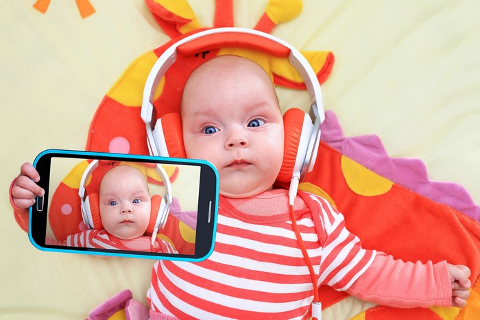 Baby with Headphones and Smartphone Selfie