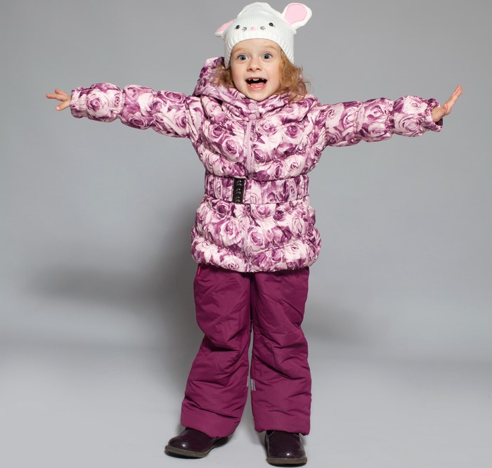 Girl in a floral winter jacket and hat
