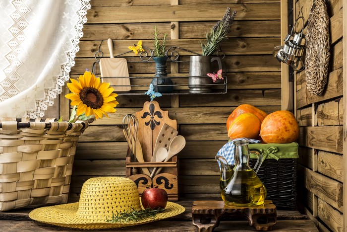 Still-life with pumpkins, sunflowers, and a hat