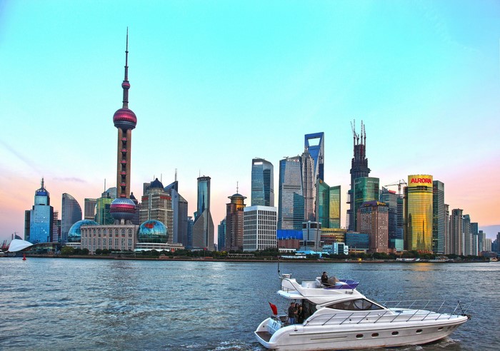 Shanghai skyline with Oriental Pearl Tower and a yacht