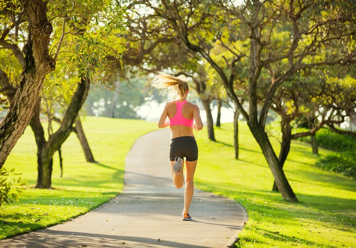 Woman running on a park path