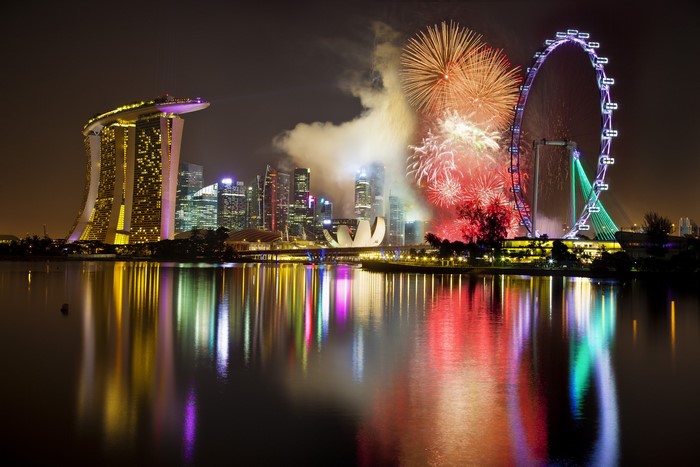 Singapore skyline with fireworks and Singapore Flyer