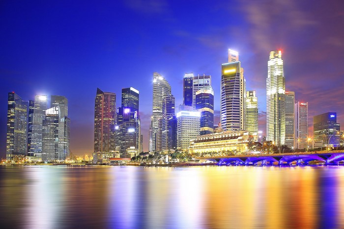 Singapore skyline at night with reflections