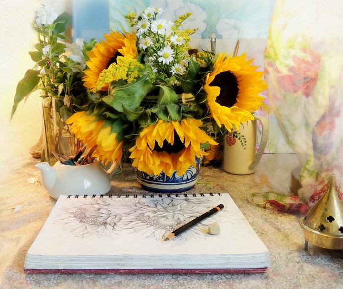 Sunflowers still-life drawing with pencils and sketchbook