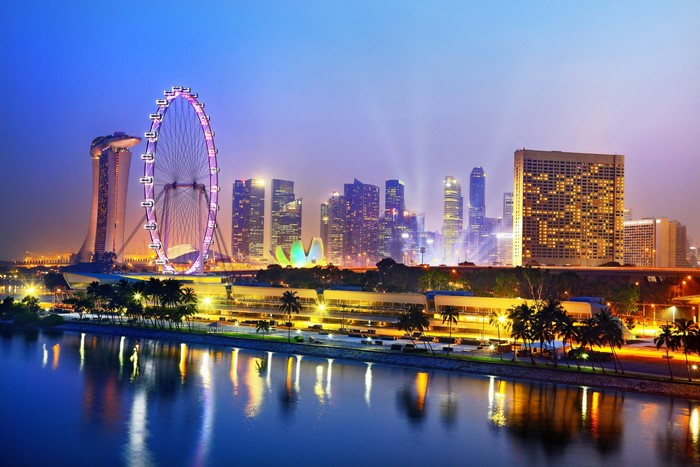 Singapore skyline with Ferris wheel at dusk