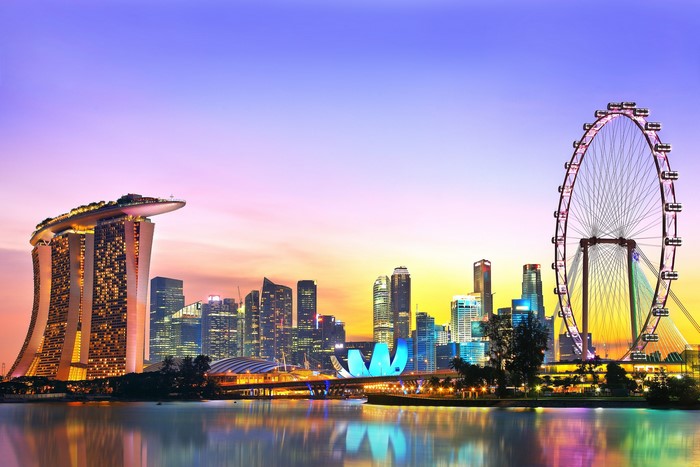 Singapore skyline with Marina Bay Sands and Ferris wheel at dusk