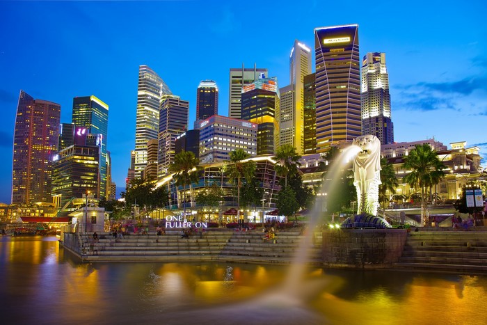 Singapore skyline with Merlion statue at night