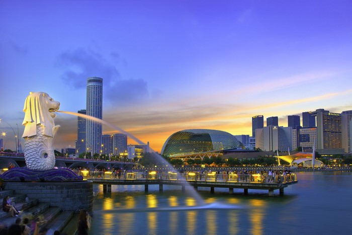 Singapore skyline with Merlion statue at dusk