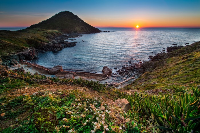 Sunset over a Mediterranean cove in France