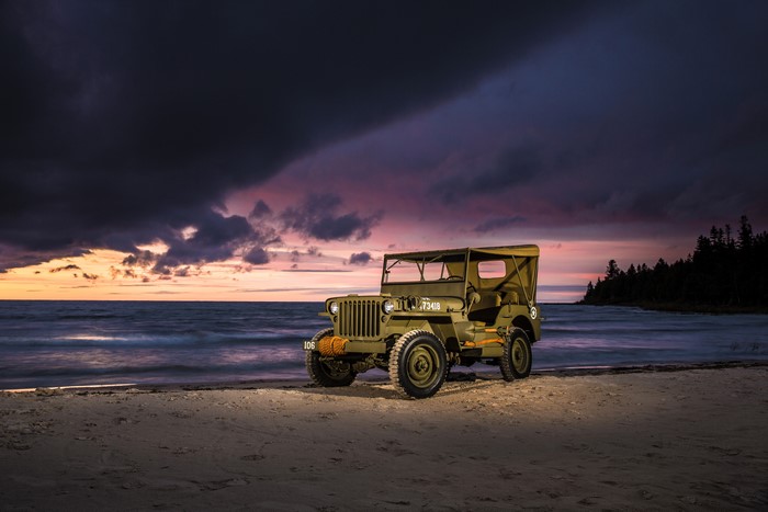1944 Willys MB Jeep on a beach at sunset