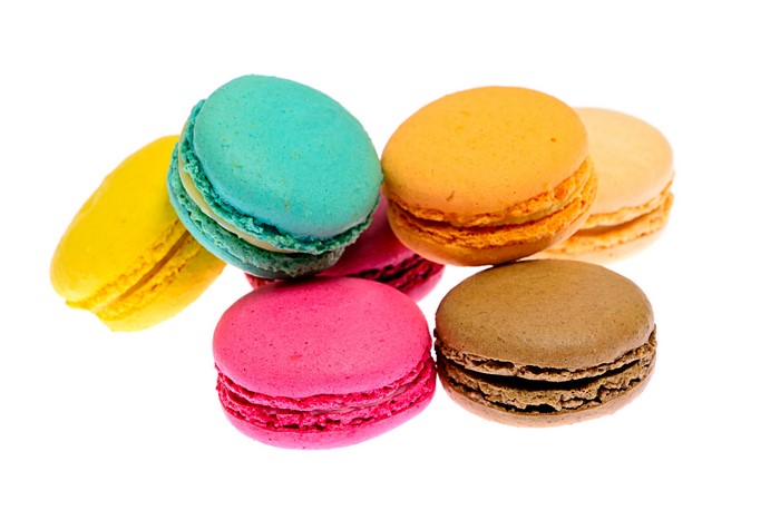 Assortment of colorful macarons on a white background