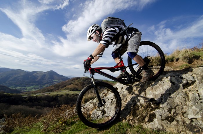 Man riding a mountain bike on a rocky trail