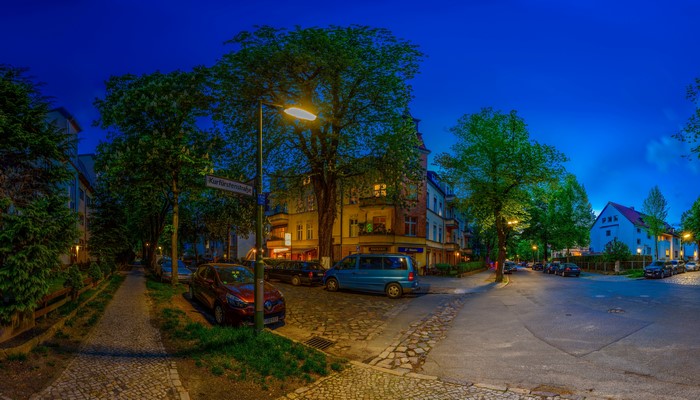 Street at night in Berlin, Germany with street lights and trees