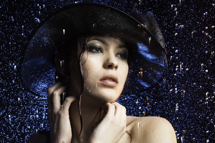 Woman in hat in the rain