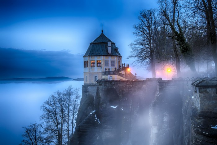Castle on a cliff in fog