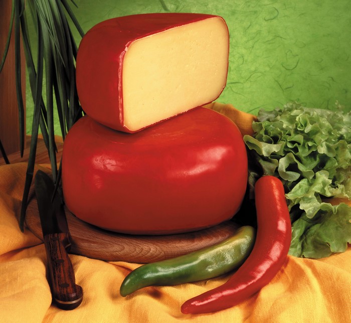 Cheese wheels with chili peppers and lettuce