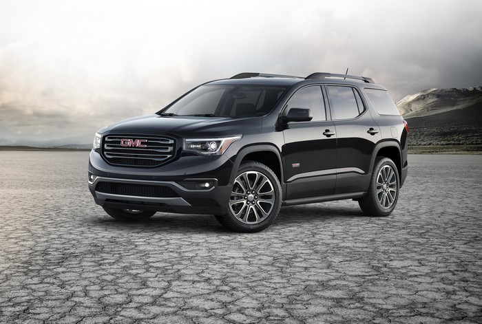 Black GMC Acadia SUV on Cracked Earth