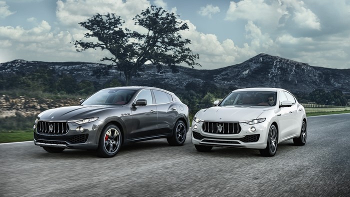 Two Maserati Levante SUVs on a Road
