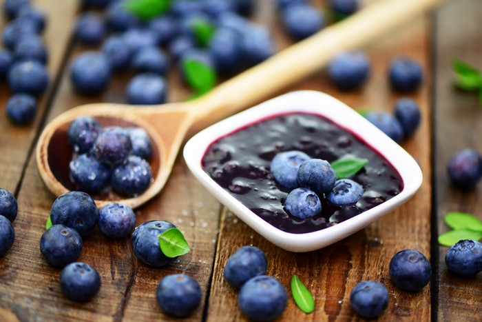 Blueberries and Jam on a Wooden Table