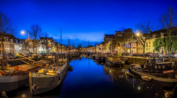 Boats on a canal in Groningen at night