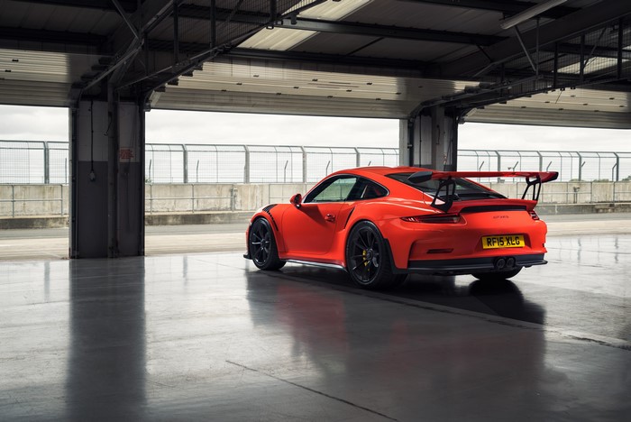 Orange Porsche 911 GT3 in a garage