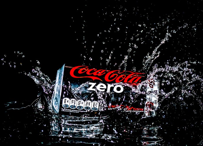 Coca-Cola Zero can splashing in water