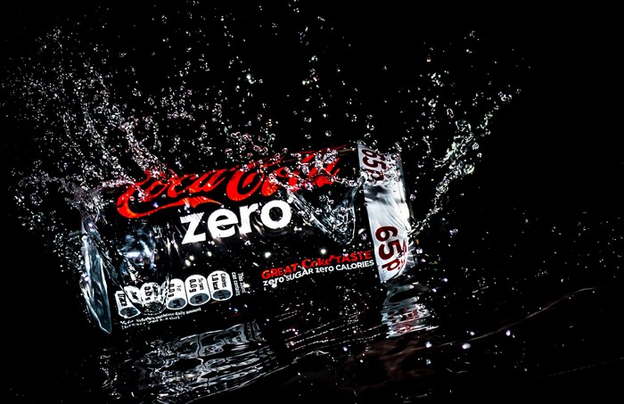 Coca-Cola Zero can splashing in water