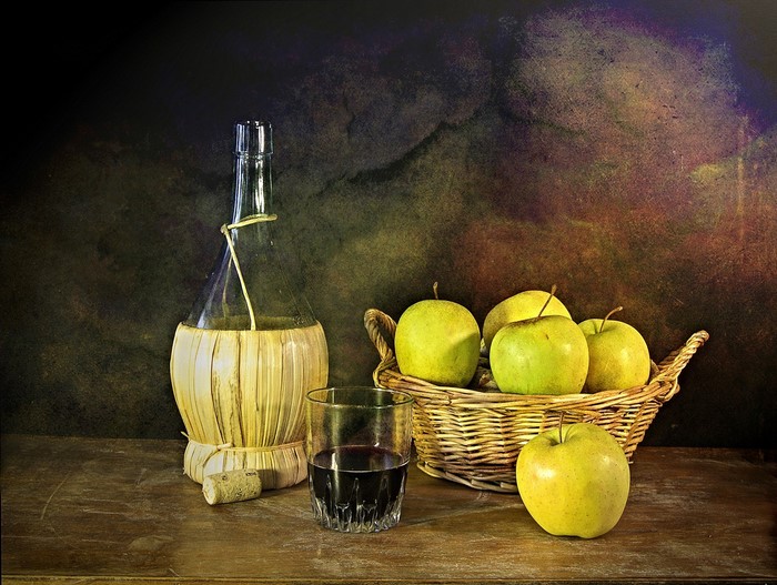 Still-life with apples, wine bottle, and glass