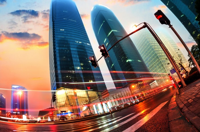 Cityscape with Skyscrapers and Traffic at Dusk