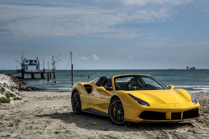 Yellow Ferrari 488 Spider Cabriolet on Beach