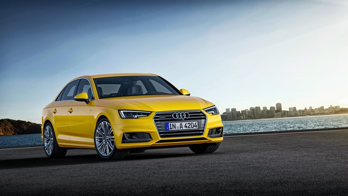 Yellow Audi A4 Sedan with City Skyline