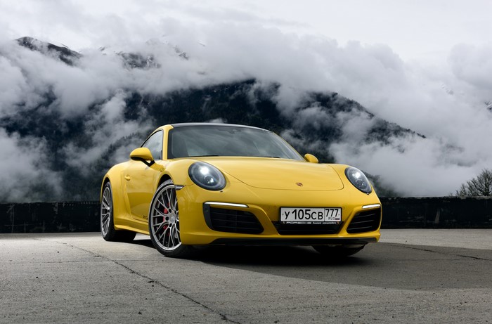 Yellow Porsche 911 Carrera 4S Coupe in Mountains