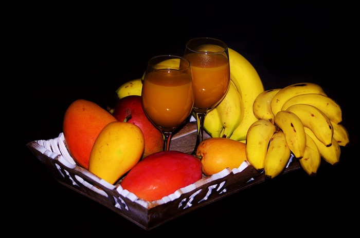 Fruit and Juice in a Basket with Black Background