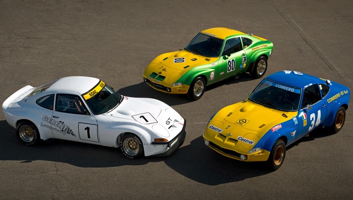 Three Opel GT race cars on a track