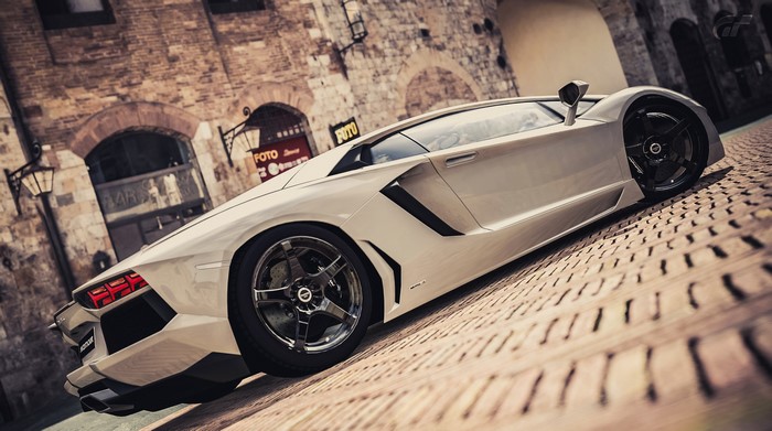 Lamborghini Aventador LP700-4 parked on cobblestone street