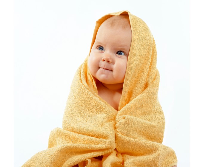 Baby wrapped in a yellow towel