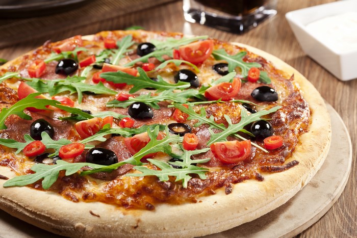 Pizza with Tomatoes, Olives, and Arugula