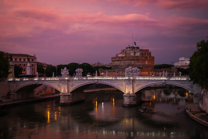 Castel Sant'Angelo bridge over Tiber River at dusk, Rome