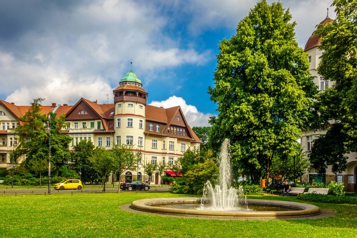 Building with tower, fountain, and trees in Berlin