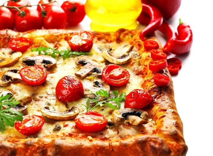 Rectangular pizza with tomatoes and mushrooms