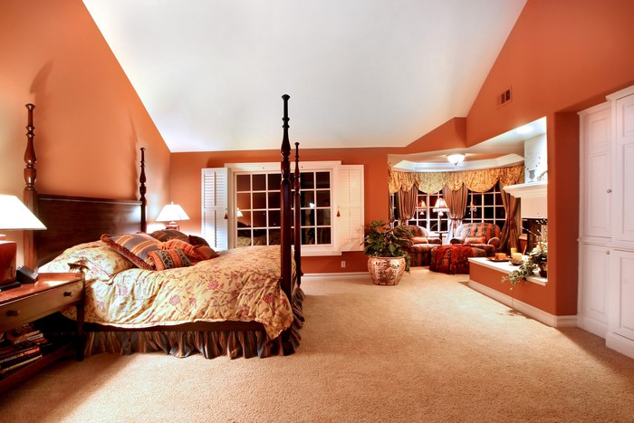 Bedroom with four-poster bed and sitting area